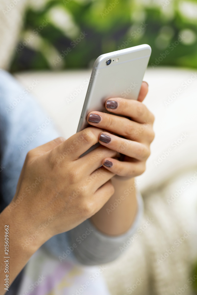Closeup of female hand using a smart phone Closeup of female hand using a smart phone