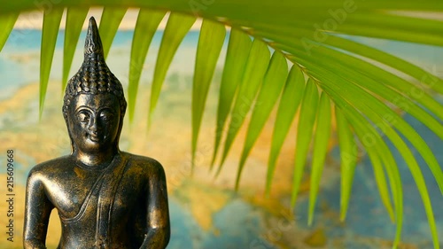 World Map. Journey Explore Concept. Abstract travel destination background with copy space. Trip Southeast Asia. Sitting buddha as symbol of asian culture. Close up slill life, soft selective focus. photo