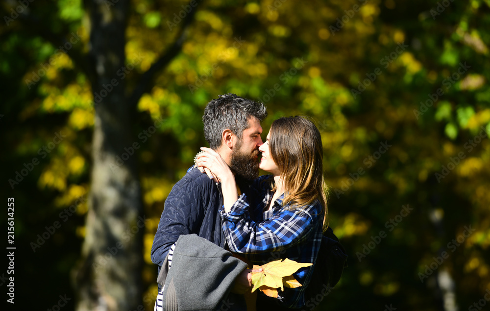 Couple in love walks in autumn park. Relationship and fall Couple in love walks in autumn park. Relationship and fall