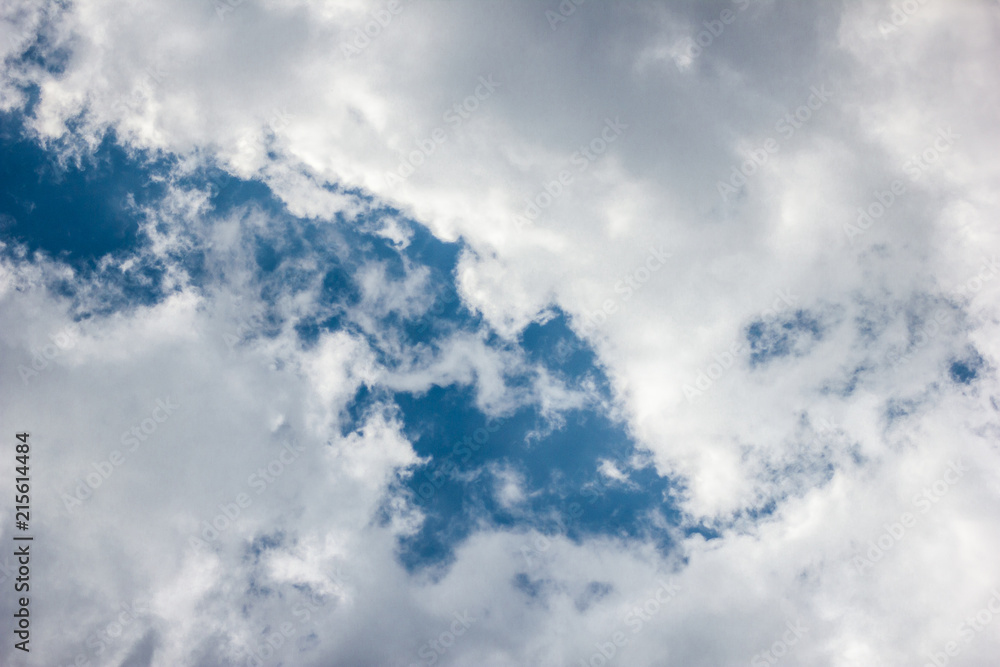 Fototapeta premium Bright blue sky with white clouds, sky after the storm with storm clouds