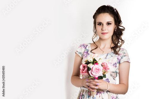 happy young woman with pink flowers bouqet on white background. free space for your text