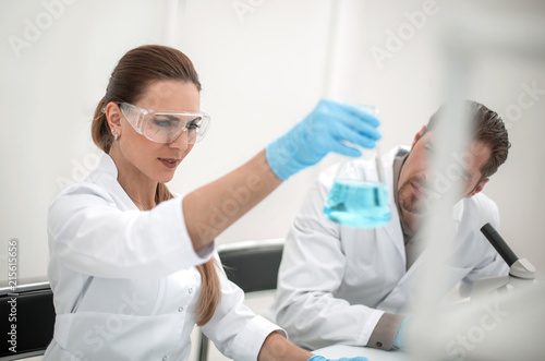 Two scientists are working in laboratory.