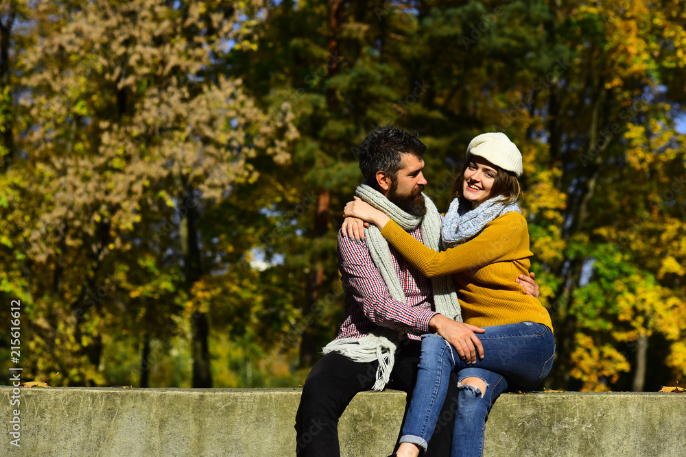 Man and woman with cheerful faces on autumn trees background Man and woman with cheerful faces on autumn trees background