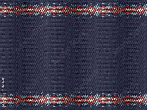Knitted striped pattern on blue woolen background.