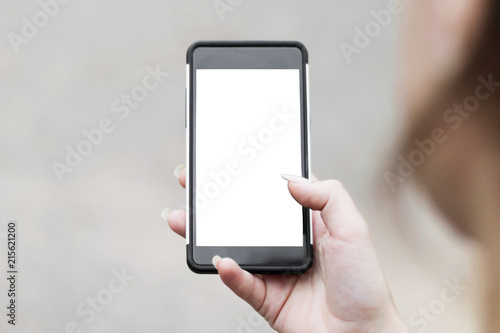 Phone in girl hand mockup