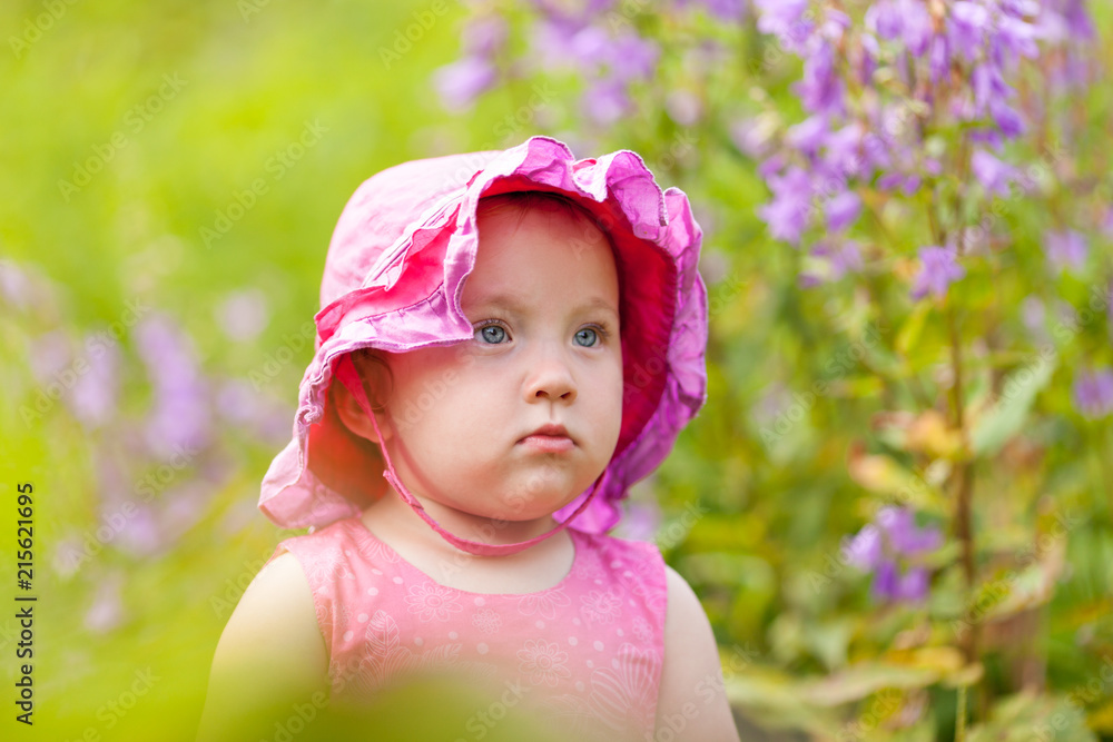 Portrait of cute little girl in summer garden Portrait of cute little girl in summer garden