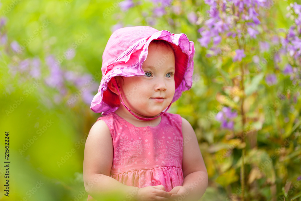Portrait of cute little girl in summer garden Portrait of cute little girl in summer garden