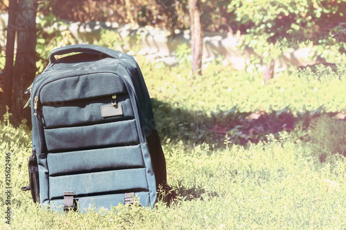 backpack bag on a grass background, back to school