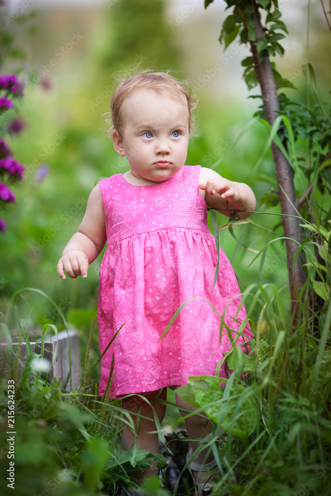 Portrait of cute little girl in summer garden Portrait of cute little girl in summer garden