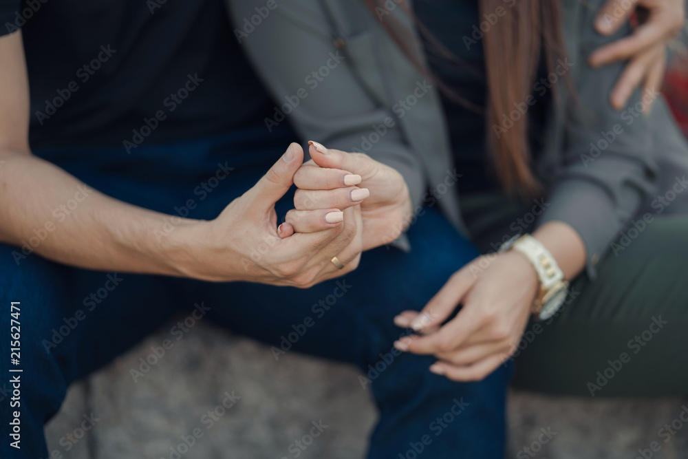 Fototapeta premium Couple holding hands, close-up
