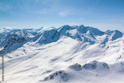 Winter snow covered mountain peaks Austrian alps photo