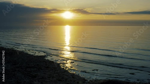 Wallpaper Mural The glowing summer sun sets over the bay and the offshore wind-farm on the horizon Torontodigital.ca