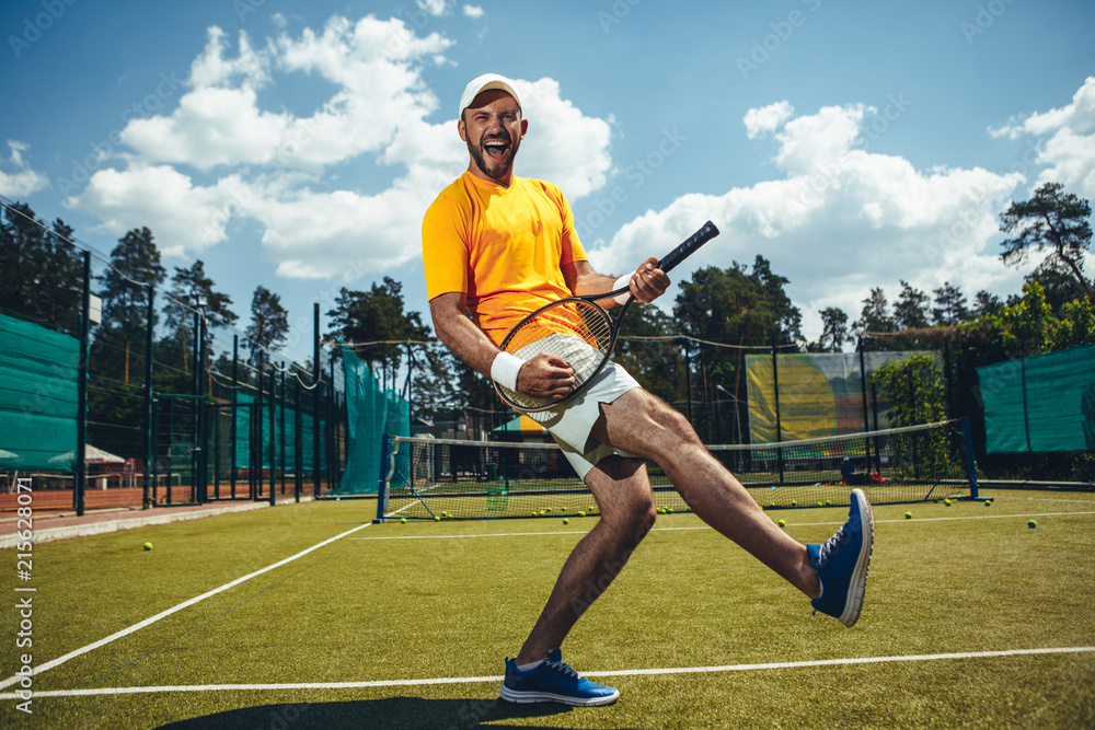 Full length portrait of cheerful man imaging he playing guitar on sport equipment on court