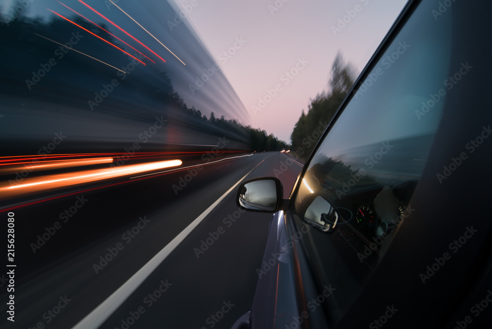 Country road in the evening or in the morning. View from the outside of the car Country road in the evening or in the morning. View from the outside of the car