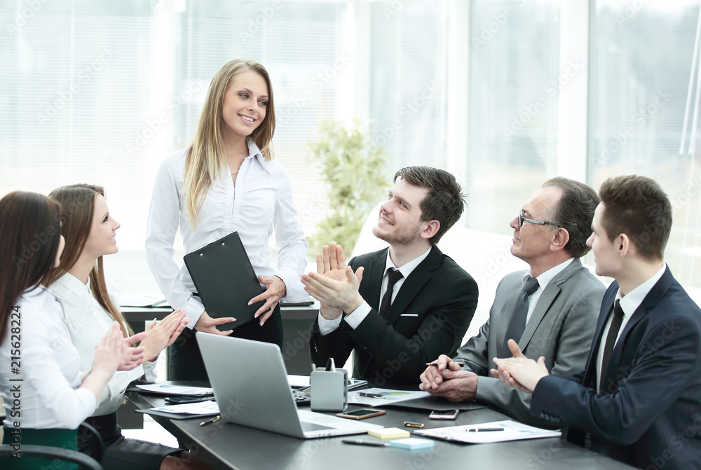 business team applauding the speaker at the meeting. business team applauding the speaker at the meeting.