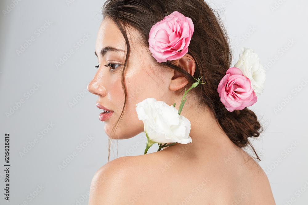 Side view beauty portrait of a pretty young topless woman Side view beauty portrait of a pretty young topless woman