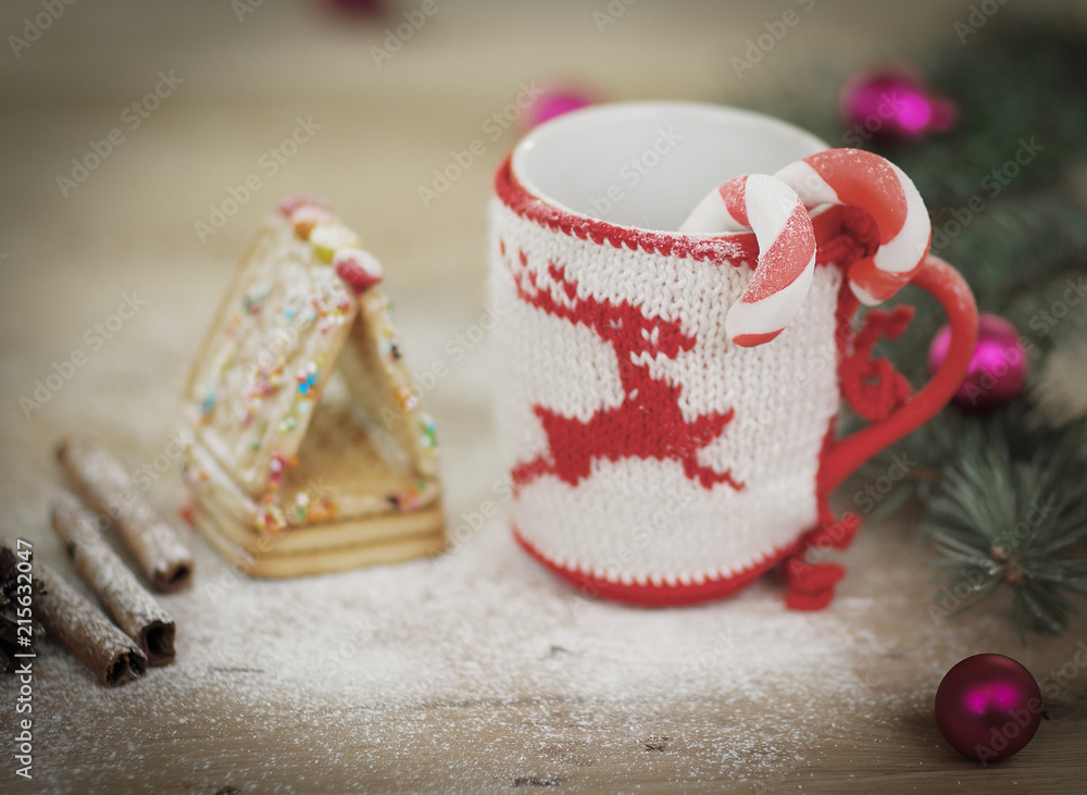 Christmas Cup ornament and sweets on wooden background. Christmas Cup ornament and sweets on wooden background.