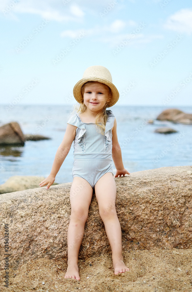 Little girl in hat walking beach sunny summer day, Instagram style, fashion, Latvia, Vidzeme, Baltic Sea