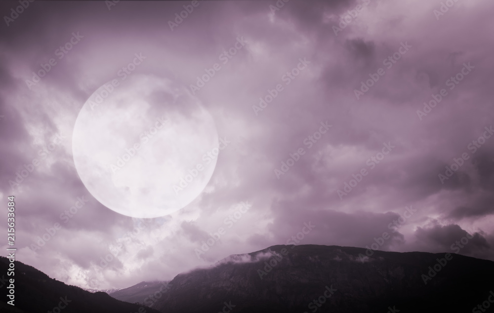 Fototapeta premium Halloween background. Spooky mountains with full moon