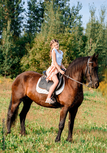 Picture of young pretty girl riding horse