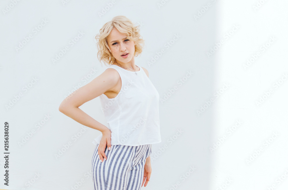 Portrait of a pretty smiling young woman. Isolated over white. Portrait of a pretty smiling young woman. Isolated over white.
