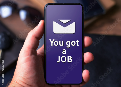 Hand with a smartphone with text You got a job