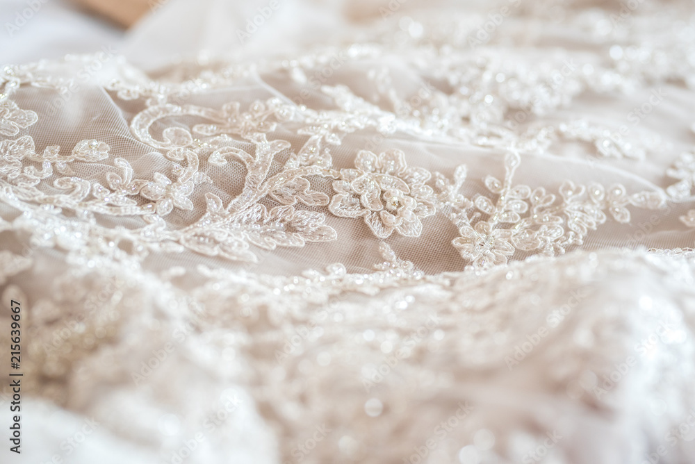 Wedding dress close up - white lace with floral pattern Wedding dress close up - white lace with floral pattern