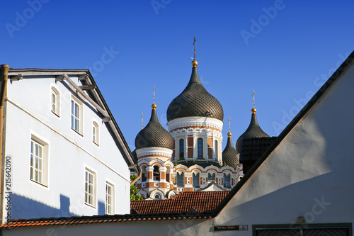 View of domes of the Orthodox Christian Alexander Nevsky Cathedral over roofs of medieval houses in Tallinn..