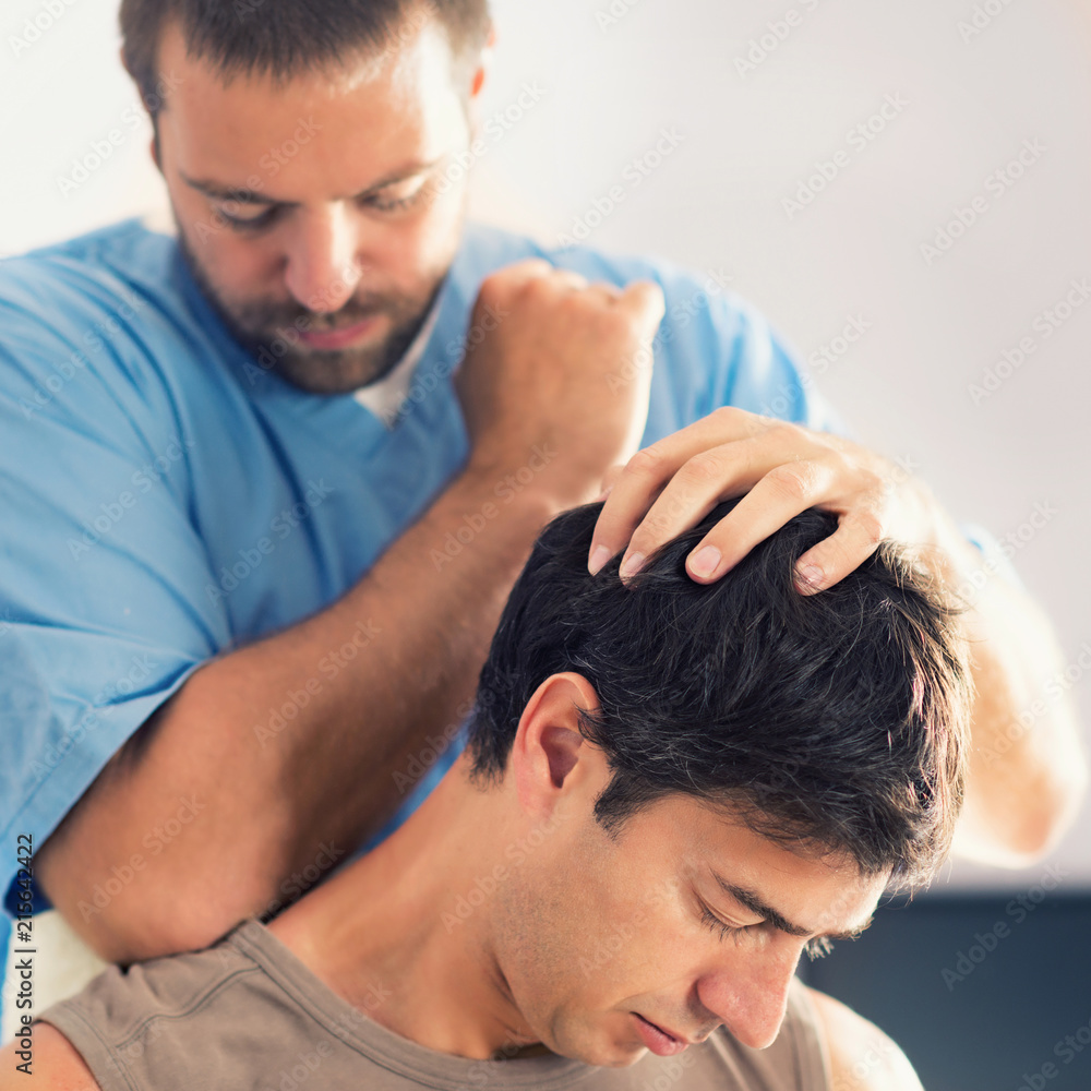Obraz premium Physiotherapist Working With Patient Neck And Shoulders