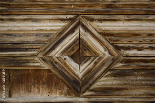Wooden rhombus symbol background