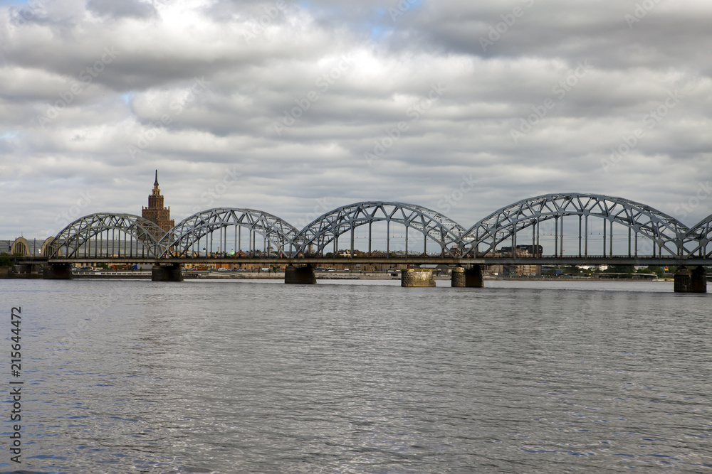 View on Railway Bridge over Daugava River and the building of the Academy of Sciences in Riga, Latvia....