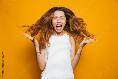 Portrait of a joyful young girl screaming