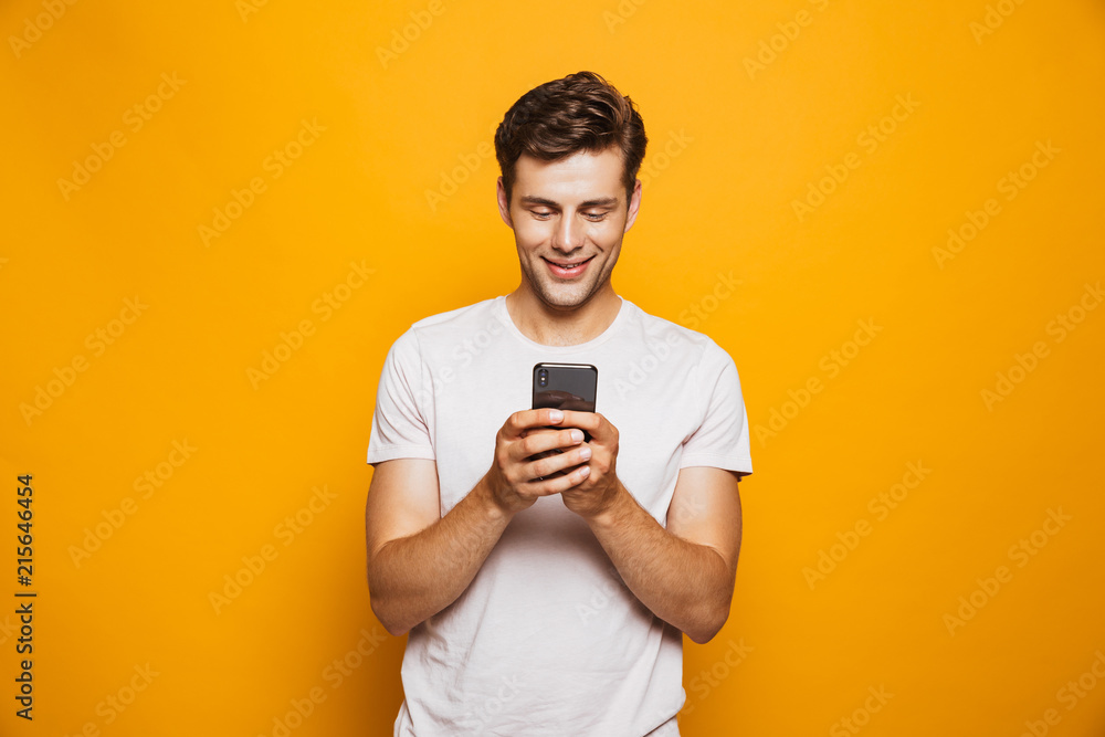 Portrait of a happy young man using mobile phone Portrait of a happy young man using mobile phone