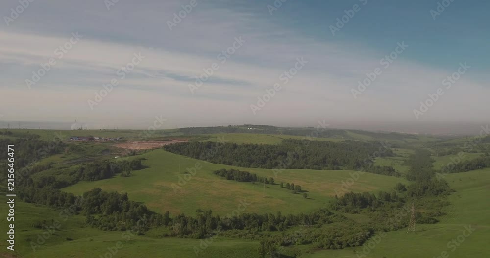 Aerial view. rural road among fields, countryside road between green field with smog. air pollution around the industrial city. 4K Aerial view. rural road among fields, countryside road between green field with smog. air pollution around the industrial city. 4K