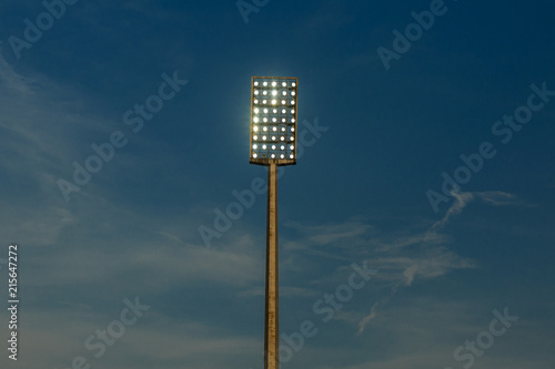 Light tower reflectors at a stadium during nightime.