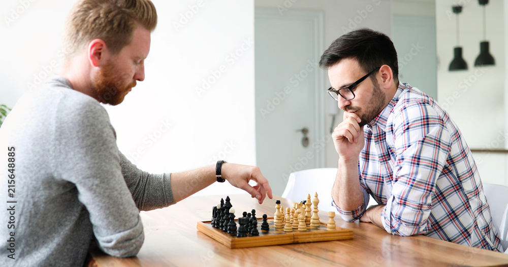 Two young man playing chess Two young man playing chess