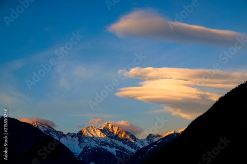 Clouds in the Snow covered Mountains