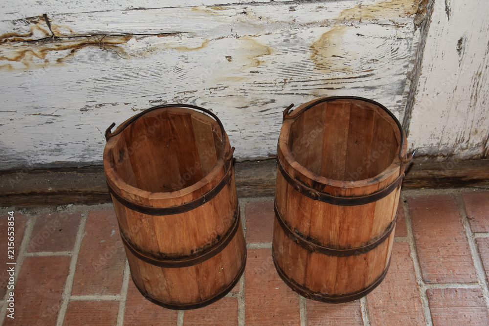 wooden buckets and barrels from the Middle Ages for storing and carrying food wooden buckets and barrels from the Middle Ages for storing and carrying food