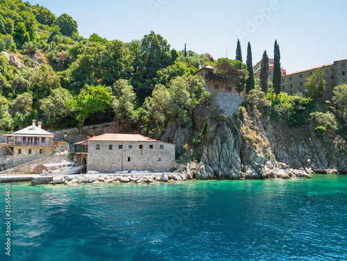 monastery buildings pier on shore of the Aegean Sea photo