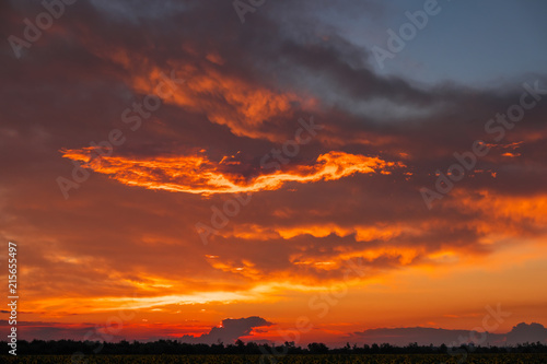 Beautiful fiery  orange and red  sunset sky. Evening Magic Scene. Composition of nature
