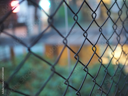 Close up of metal cage, chain link fence