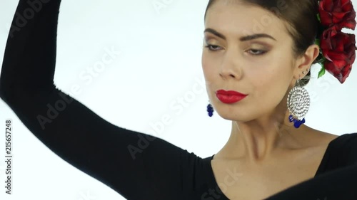 Young woman is dancing traditional Spanish dance. flamenco dancer on a light background. 4K