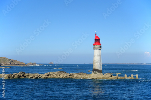 Lighthouse on rocks in channel approaching St malo