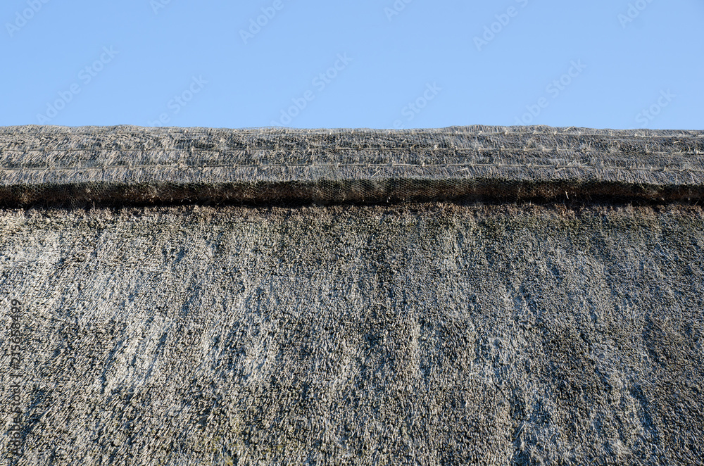 Old thatched roof on old building Old thatched roof on old building