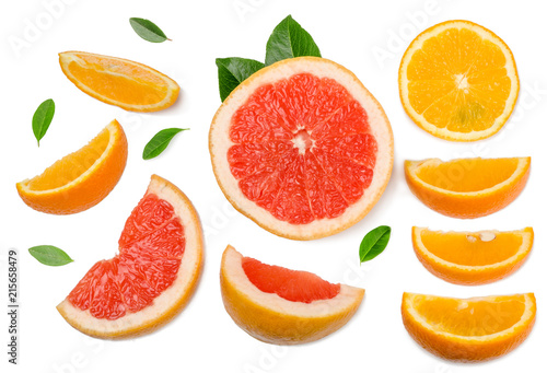 Sliced pieces of grapefruit  orange  lemon isolated on white  top view