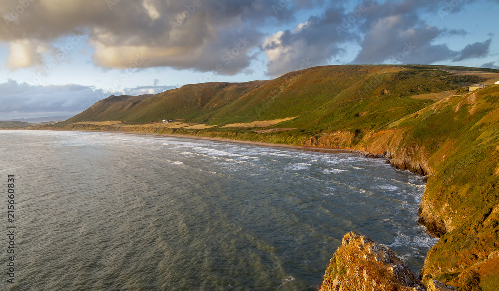 Editorial SWANSEA, UK - July 25, 2018: The coast of Rhossili Down on the Gower peninsula in Swansea, South Wales, voted one of the top ten beaches in the UK
