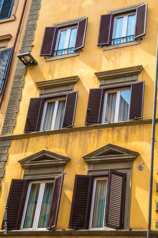 Typical windows of Florence architecture in monumental building. Florence, Italy