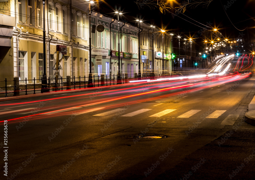 Night view to the road in the city. Car light trails. Motion blur.
