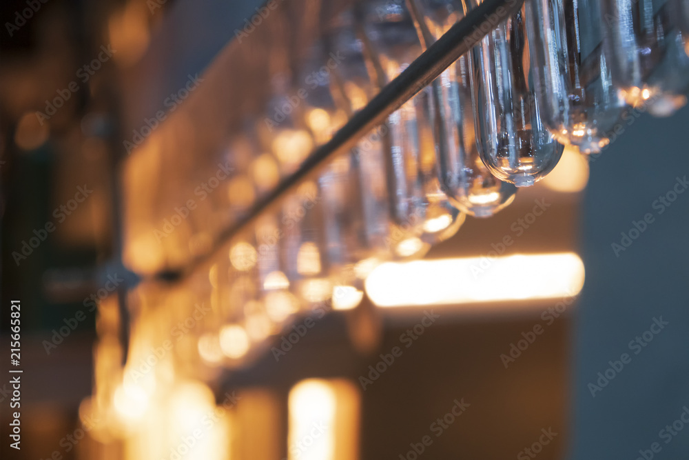 The preform shape of plastic bottle product in the heater for preheating process.Plastic bottle container manufacturing process. The preform shape of plastic bottle product in the heater for preheating process.Plastic bottle container manufacturing process.