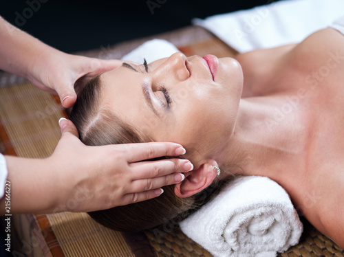 portrait of young beautiful woman in spa environment.   photo